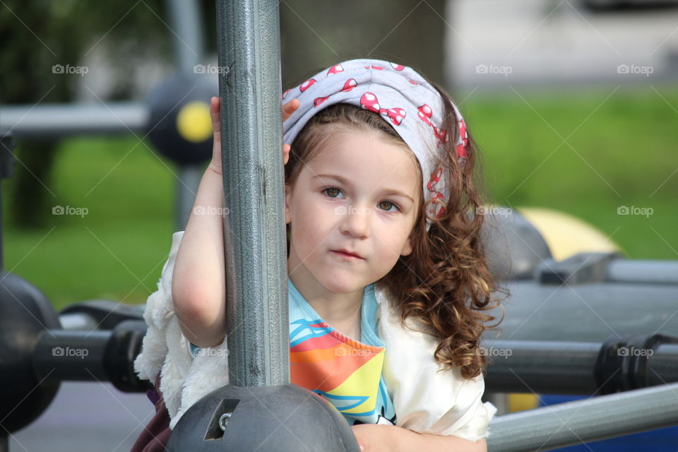 Close-up of a pretty girl in the playground