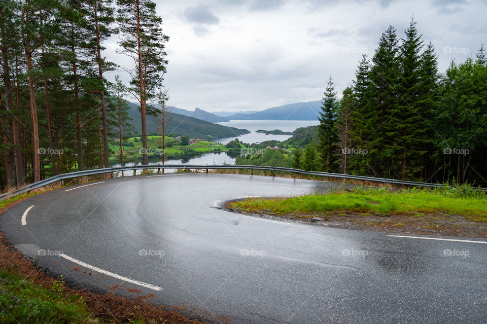 Open road. Empty road with no traffic. Wet road after rainy afternoon.