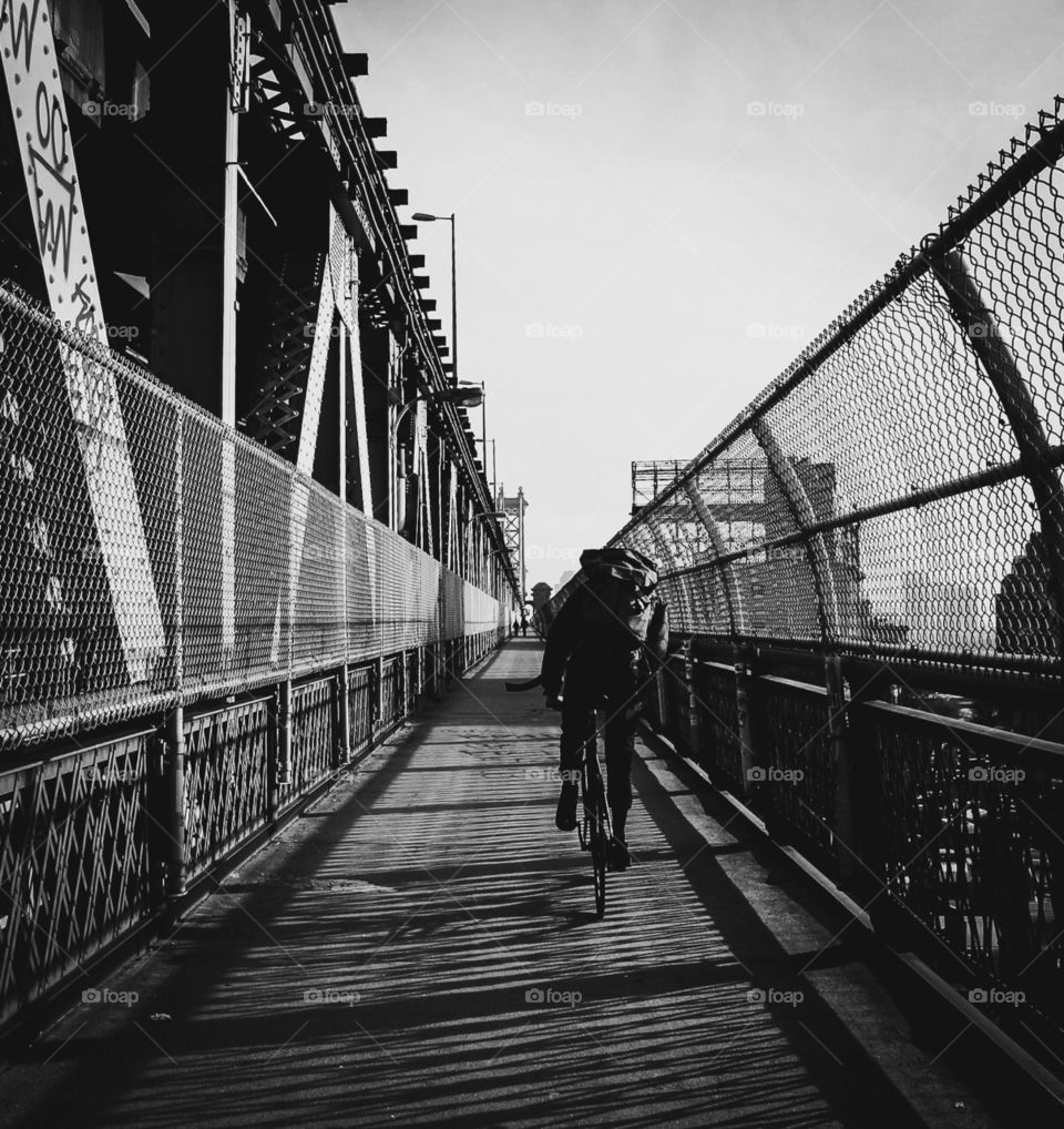Biker on Manhattan Bridge in NYC