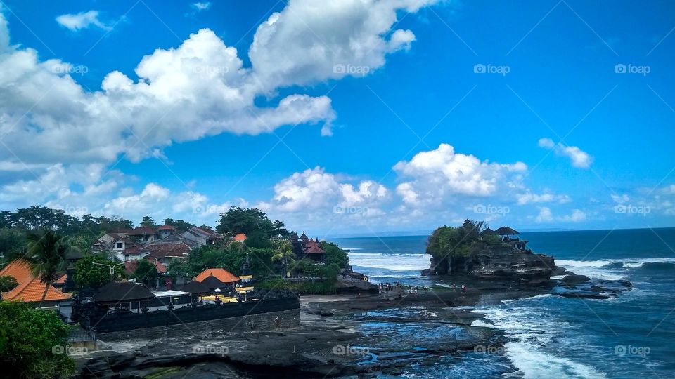 View of the beach with the temple on the edge in high angle view