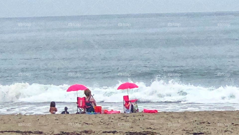 Family at the Beach Pink Umbrellas Lifestyle Photography 