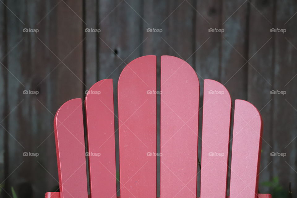 Ok art of wooden chair against wooden fence