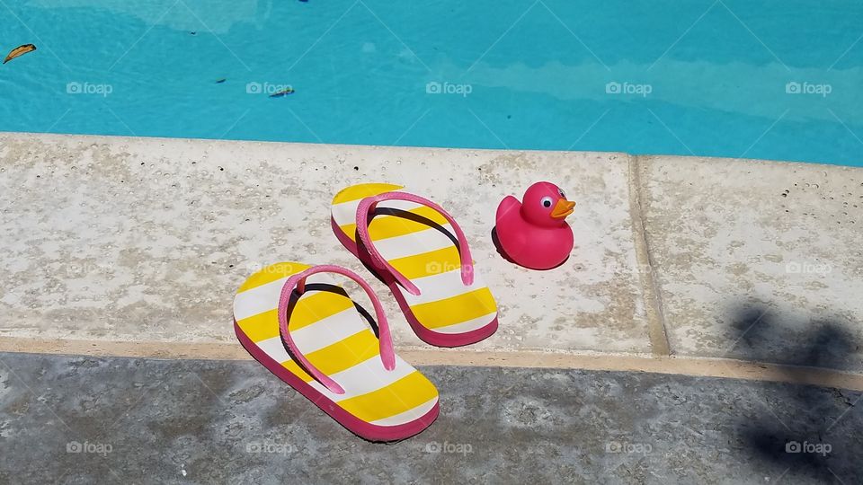 Pink duck and flip flops