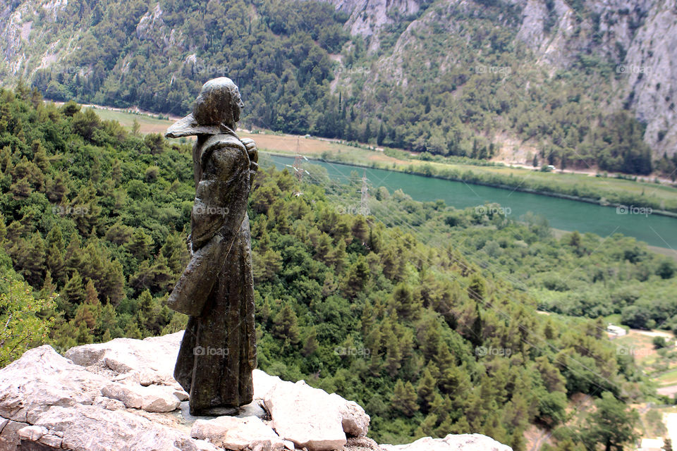 Mila Gojsalic statue over river Cetina estuary. In 1530. year, after she seduced ottoman leader Ahmed-Pasha, she set the gunpowder storage of Turkish army on fire and died with Ahmed-Pasha and his officers and Turkish army lost battle and gone away.