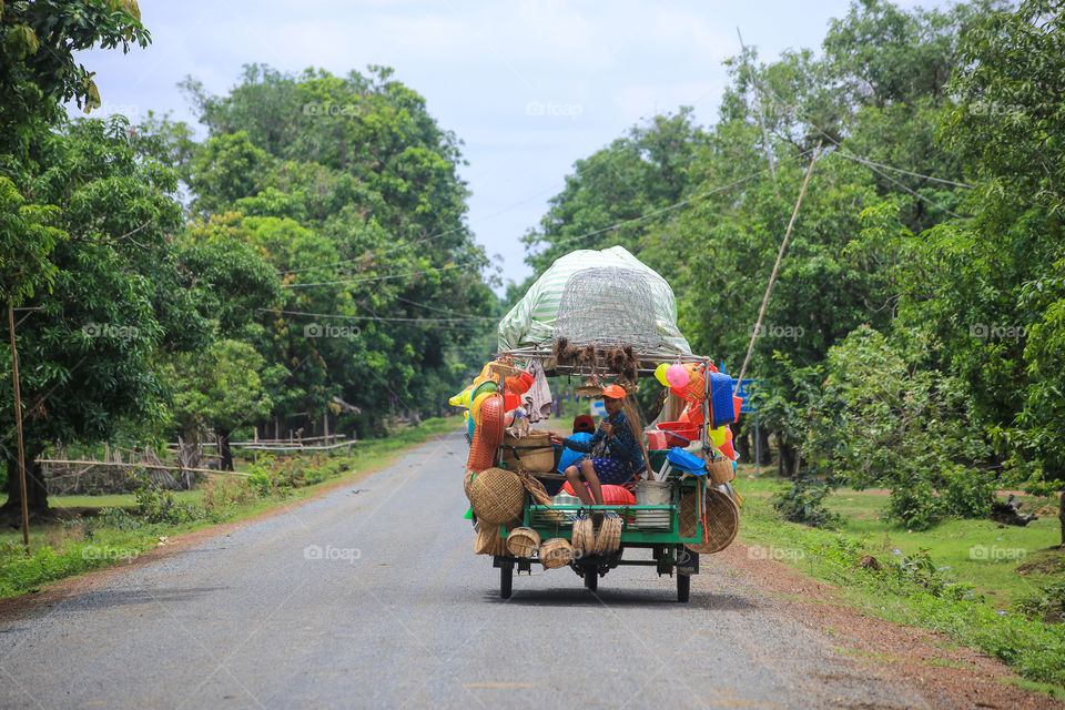 Mobile store in Cambodia . I shoot this picture when I am in a car.