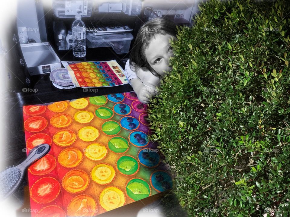 Shy Girl Hiding Behind A Bush And Happy To Have Accomplished The Colorful Fruit Puzzle! Yay!