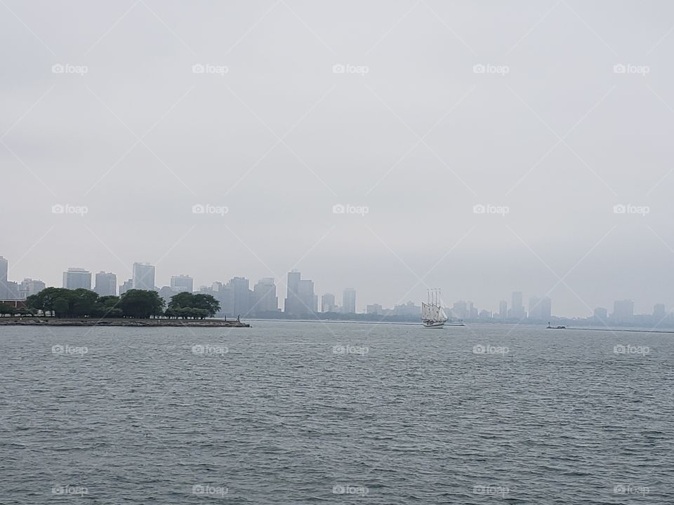 A foggy look on the Navy Pier skylines and the ship Windy
