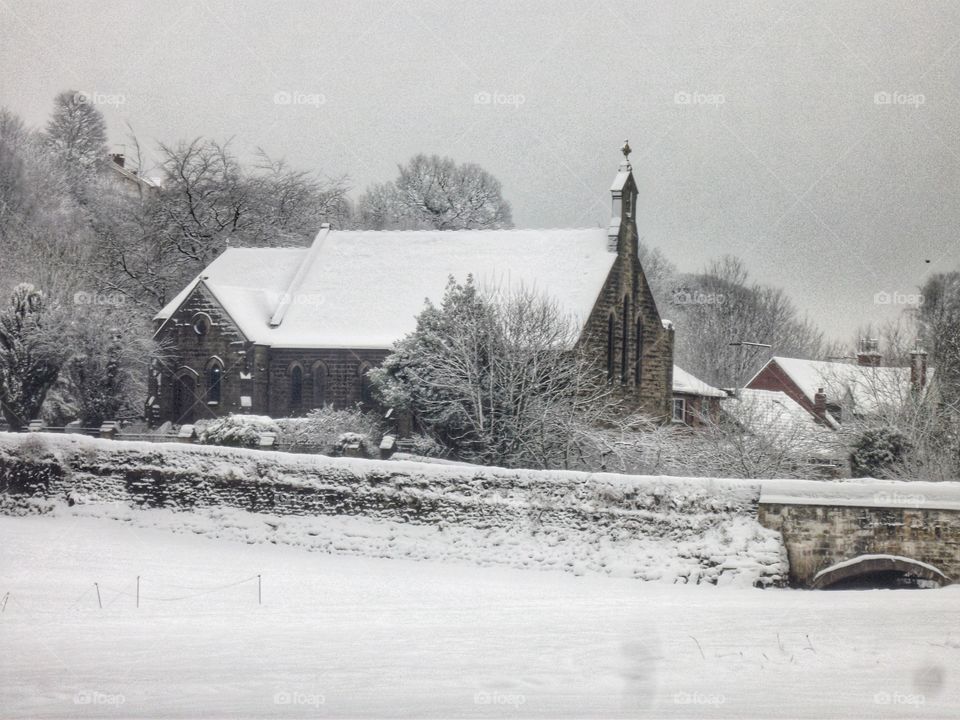 Snow covered tiny church
