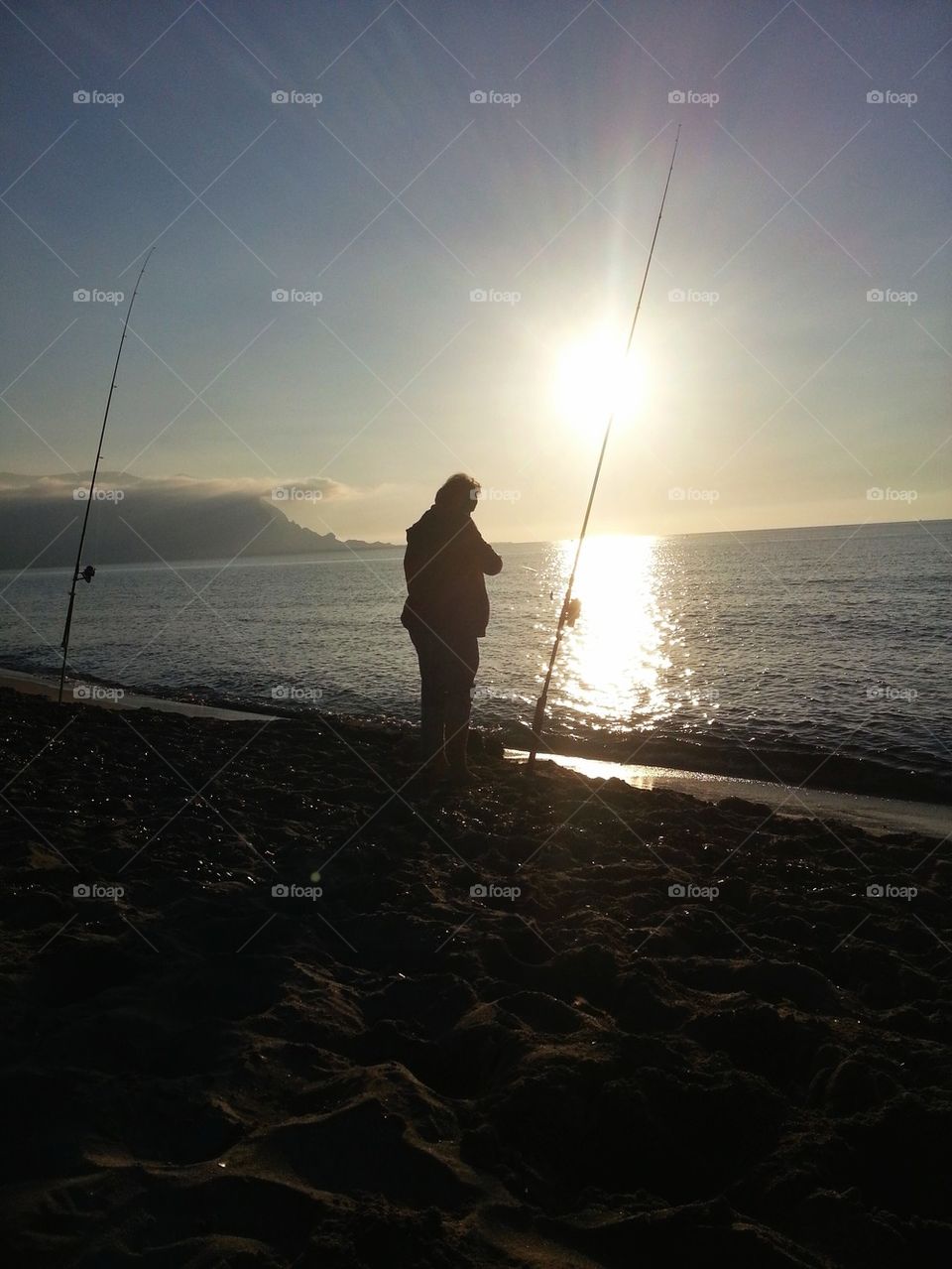 fishing at sunset