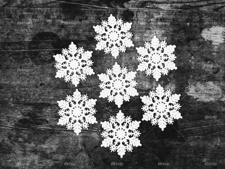 snowflakes arranged on a table in black and white