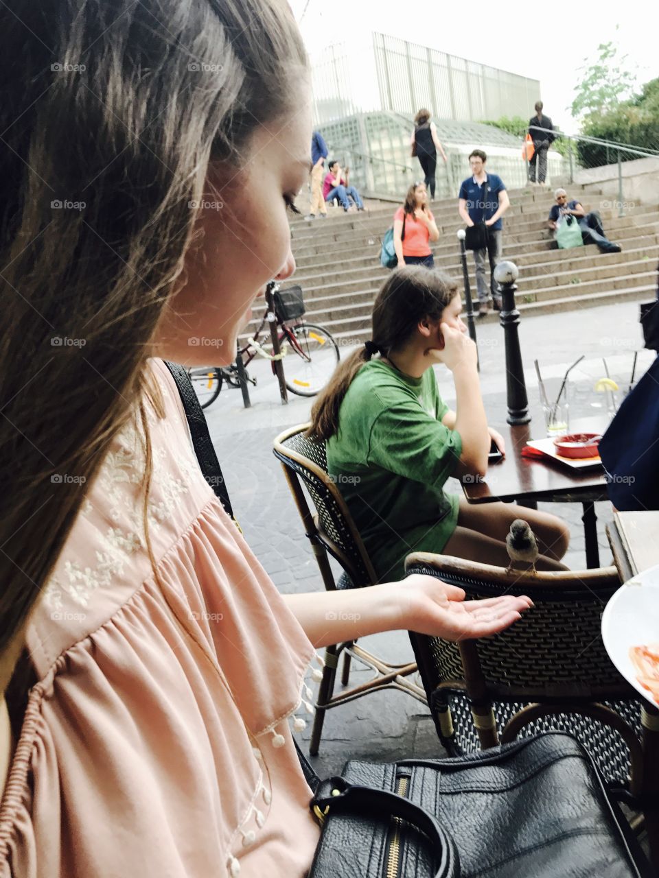 Woman giving hand on sparrow