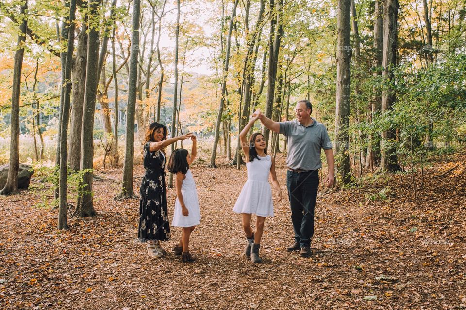 Family dancing in the forest