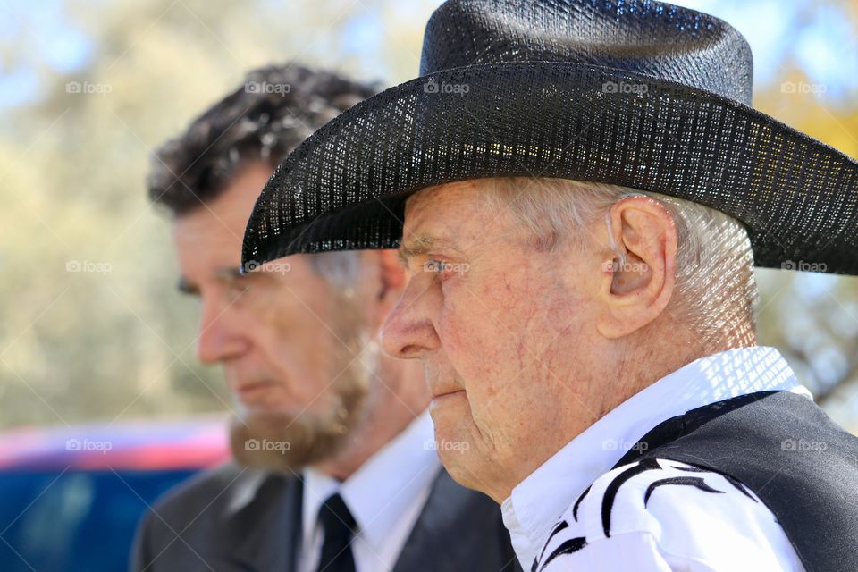 Elderly cowboy talking to President Abraham Lincoln