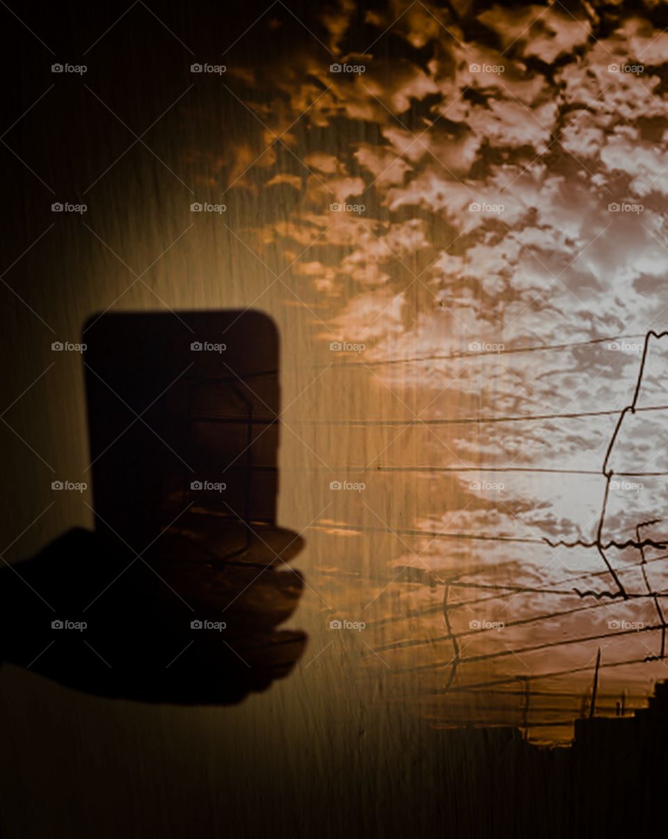 Title- Sunset selfie
Description- mobile,hand,selfie,sunset,dramatic sky