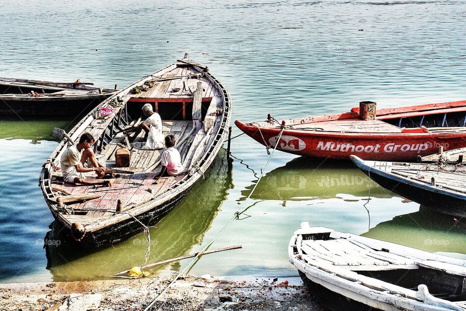 Men working on Boat, River Ganges, Varanasi, India   . Men working on Boat, River Ganges, Varanasi, India   