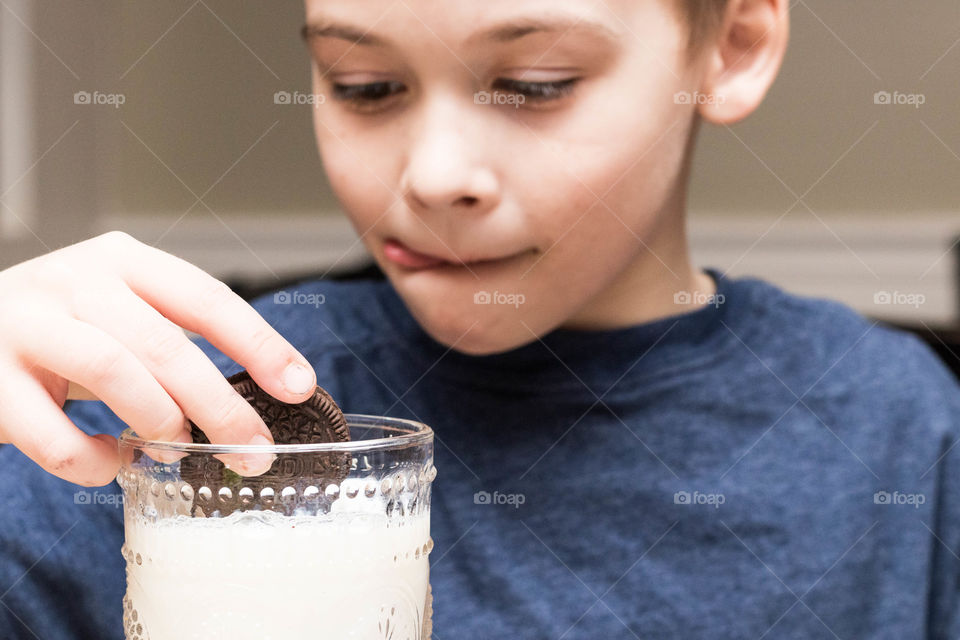 Dunking Oreo in milk