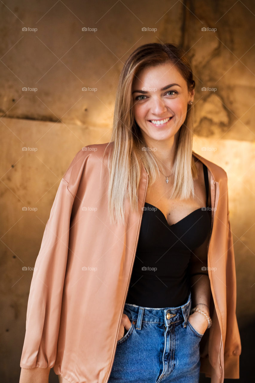 Beautiful blond girl posing on camera