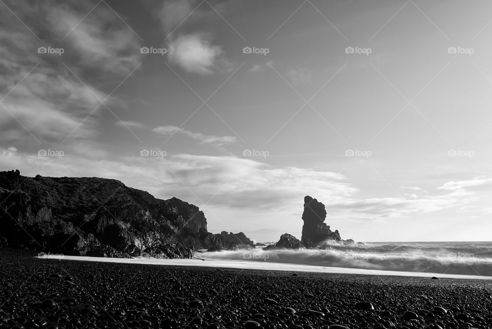 Djupalonssandur black beach in Snaefellsnes peninsula in Western Iceland in black and white long exposure on October evening. 