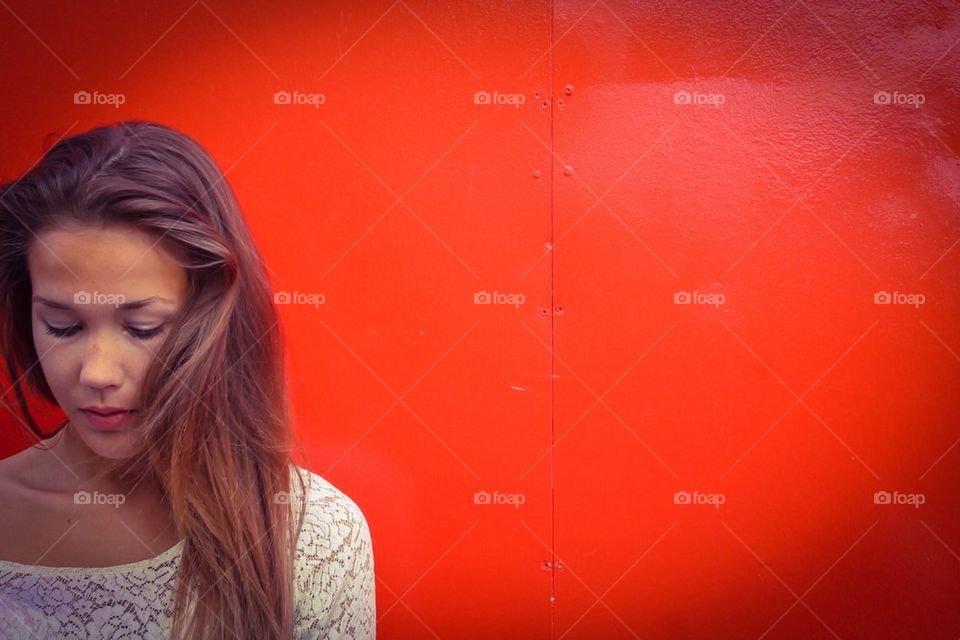 Girl and red wall
