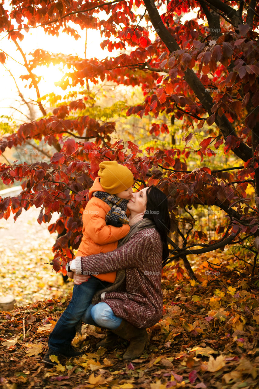 Close-up of a mother with her son in park