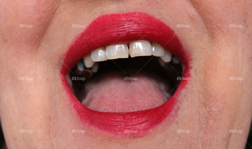 woman's mouth with red lipstick