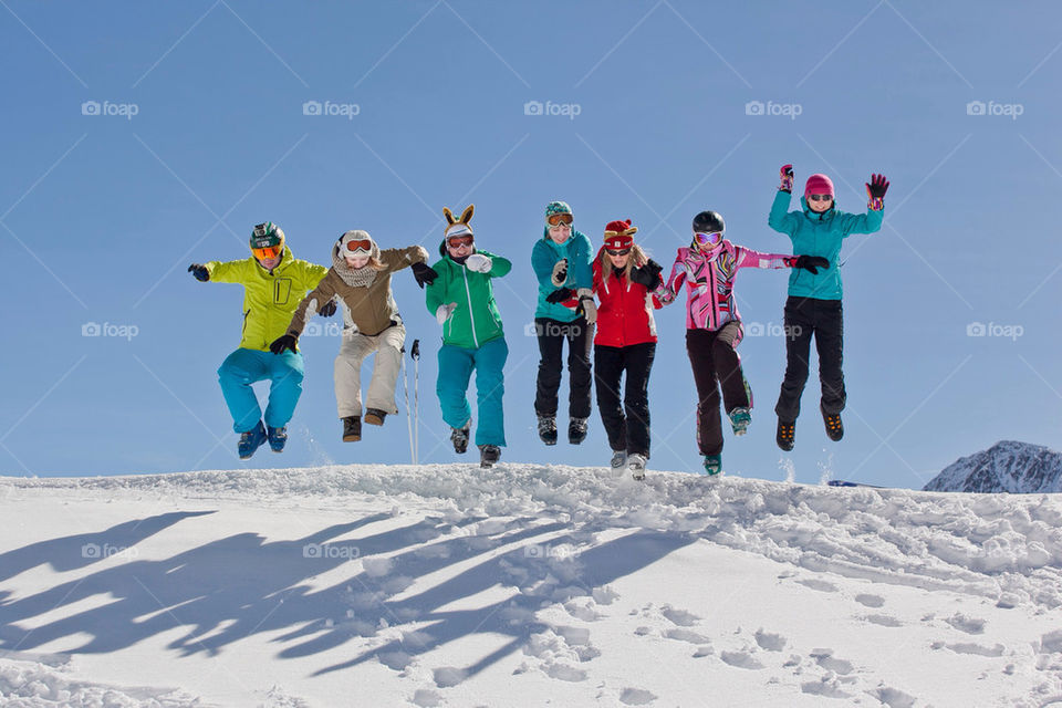 People jumping on snow