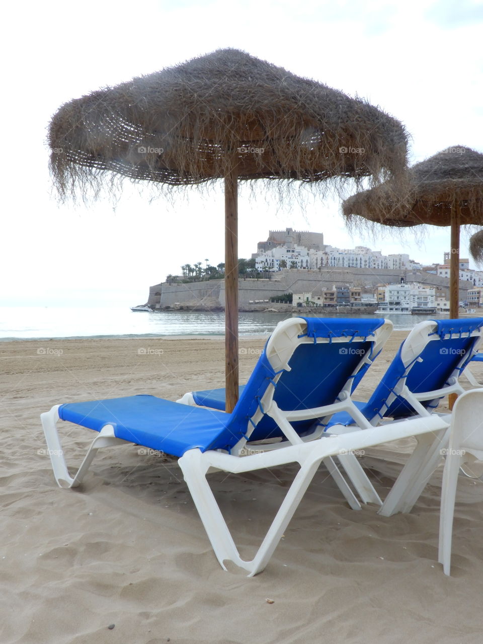 Peñíscola beach with sunbeds and umbrellas