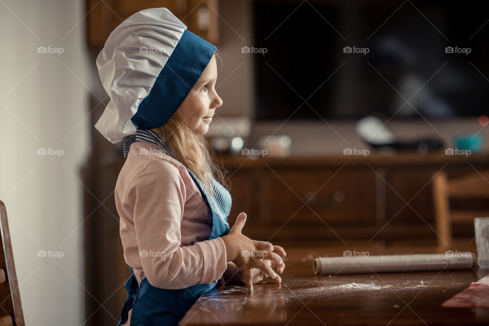 Little sisters cooking the biscuits 