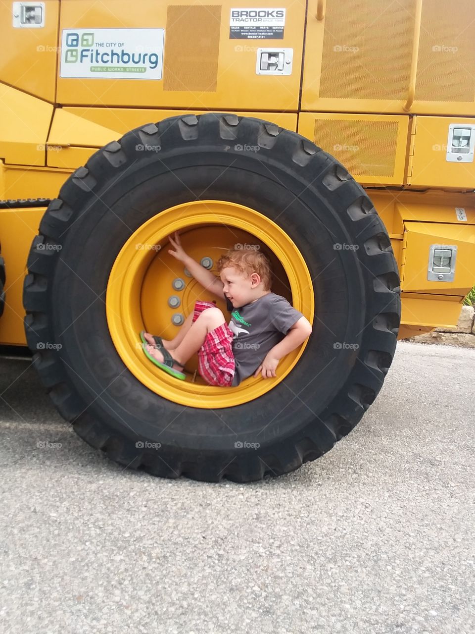 boy in wheel on truck