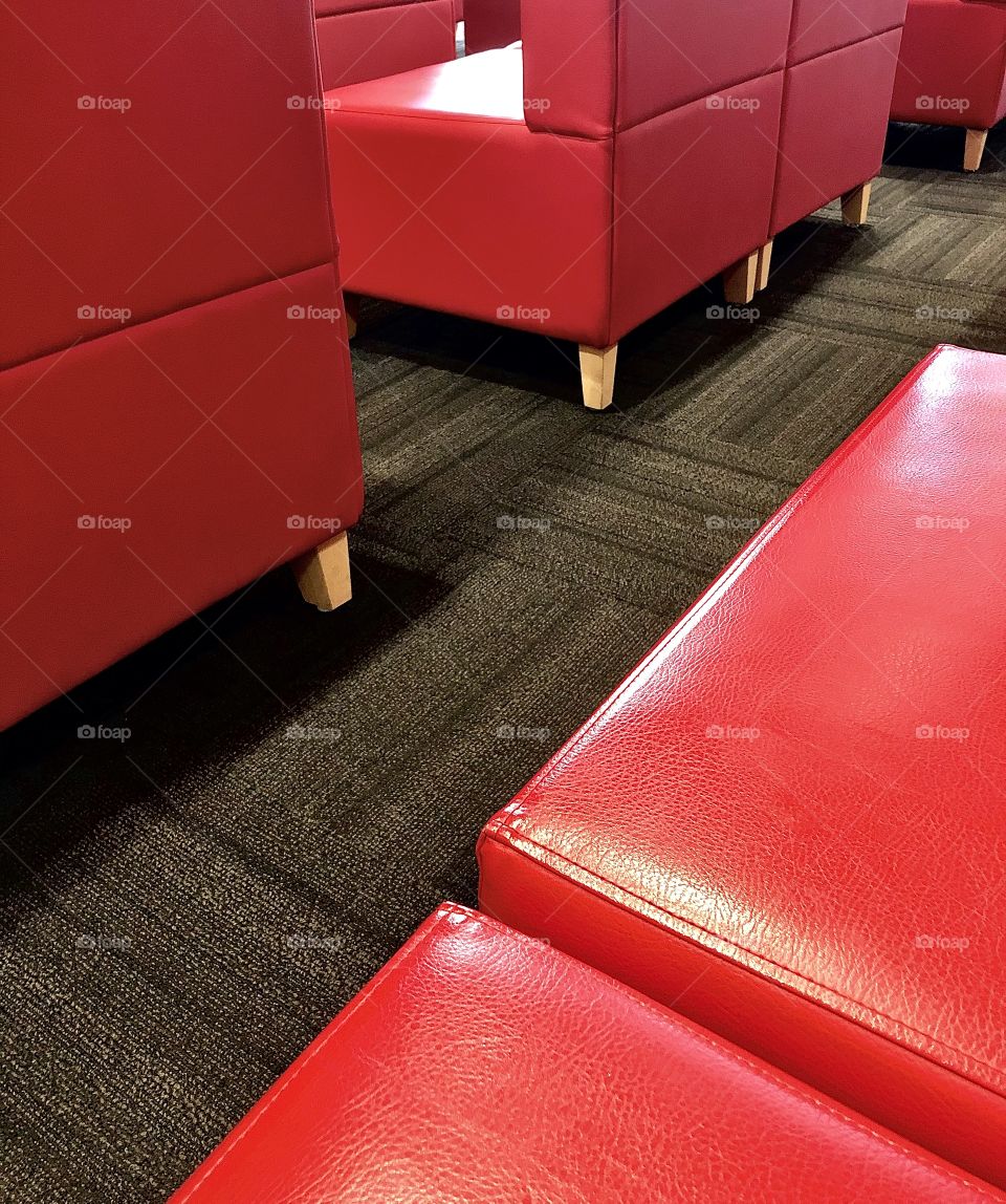 Red chairs in waiting room 