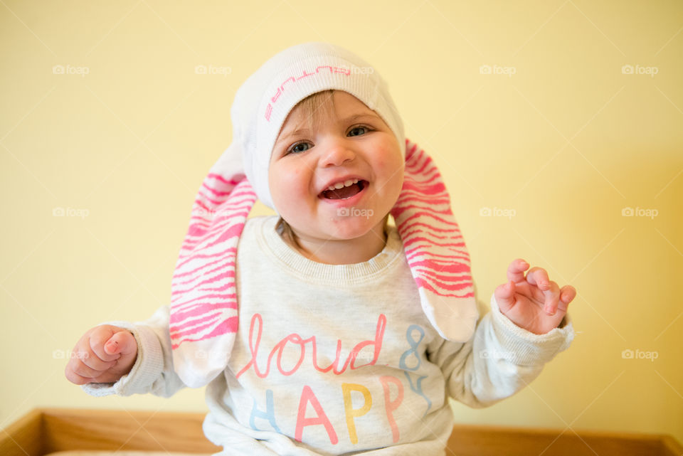 baby wearing tights on her head