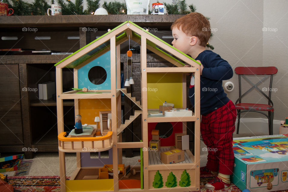 Boy and his doll house