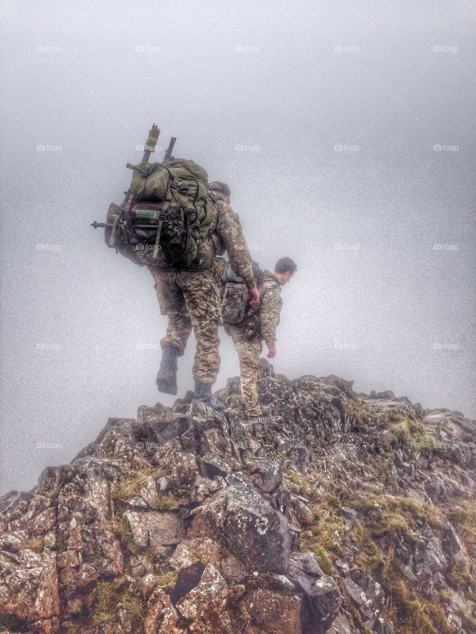 Soldiers climbing over the mountains 