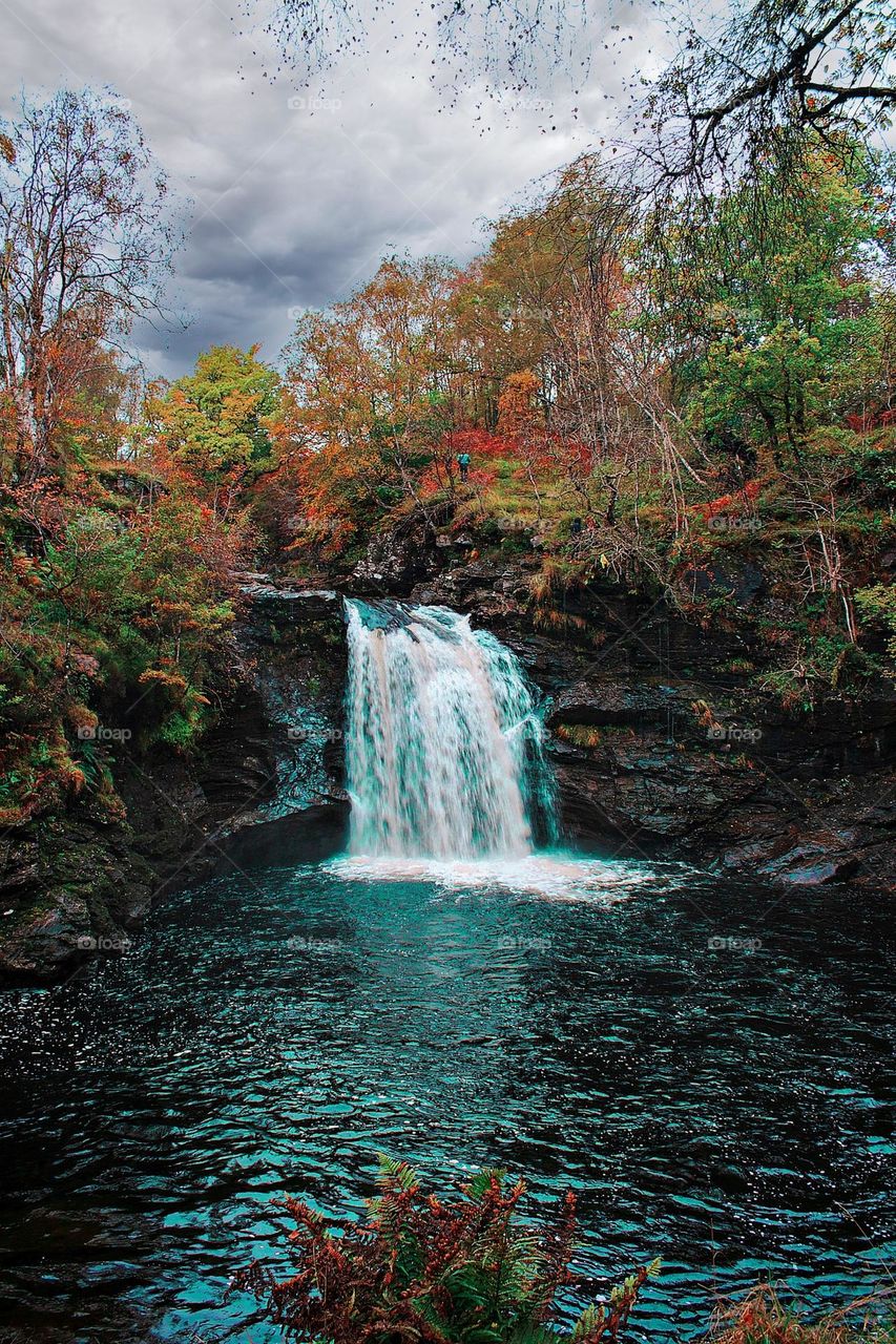 Waterfall and river in the valley