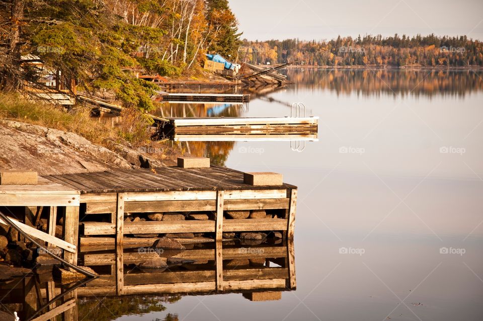 Docks down the shore at the Canadian lake