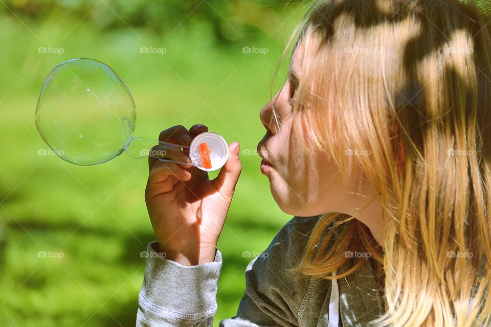 Blowing soapbubble