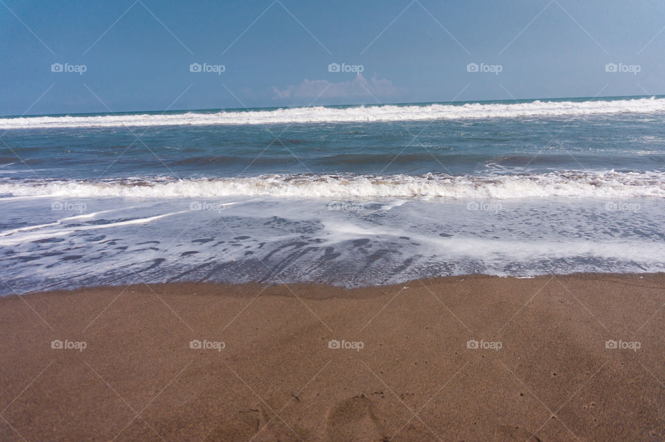 Beach with blue sky as background