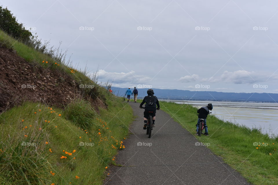 Young boys riding their bikes.