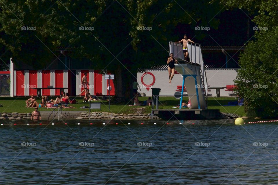 Teenage Girl Jumping Off Springboard