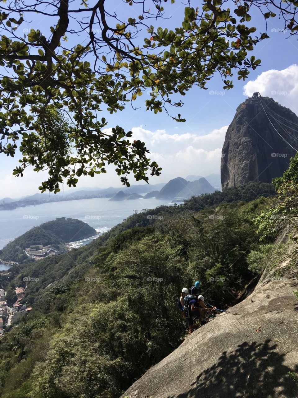 View of Rio de Janeiro. From above you can see the sea, the mountains, the sugar loaf and adventurers enjoying the day doing rappel.