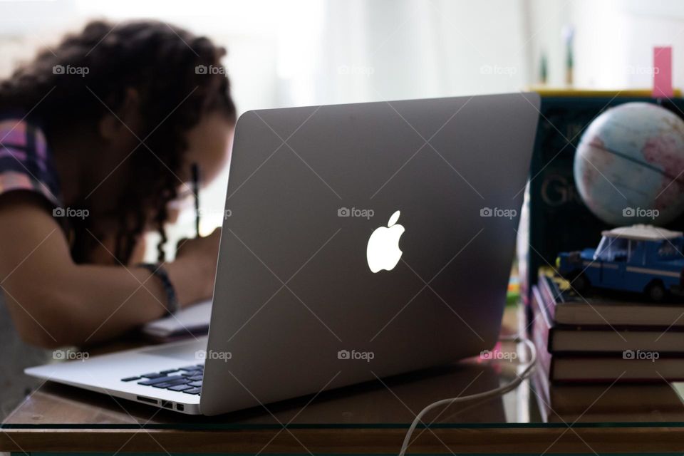 little girl studying online