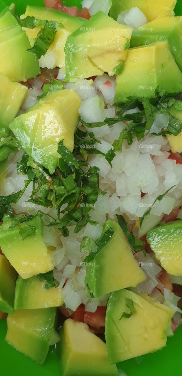 Divine tomato salad onion and a rich avocado of beautiful green and rich flavor