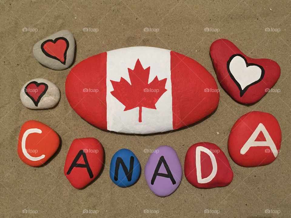 Souvenir of Canada on colored stones with national flag