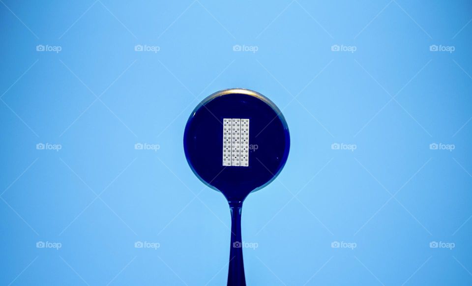 LED streetlight against a blue sky.