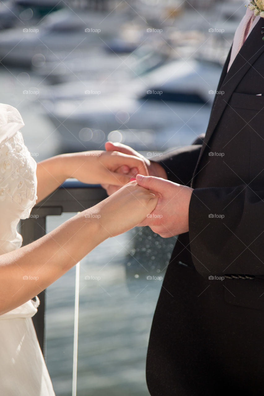 A bride and groom holding hands