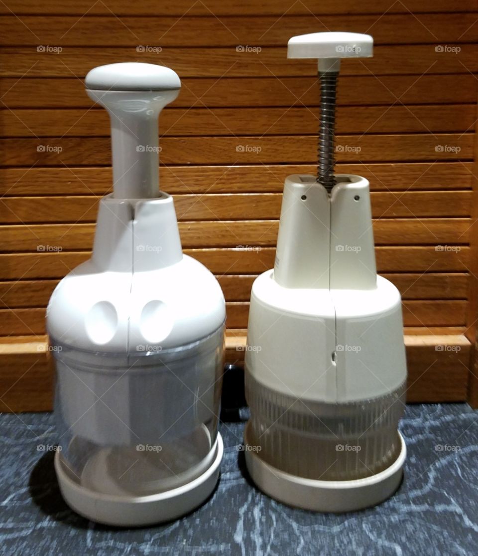 Kitchen utensils like a new chopper & an older type chopper. Good comparison of the old and the new things for cooking in the kitchen.