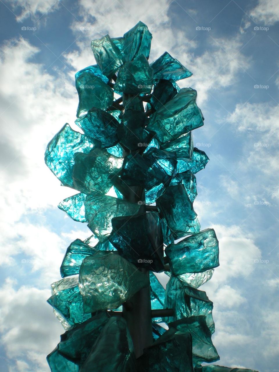 Teal colored glass against the sky