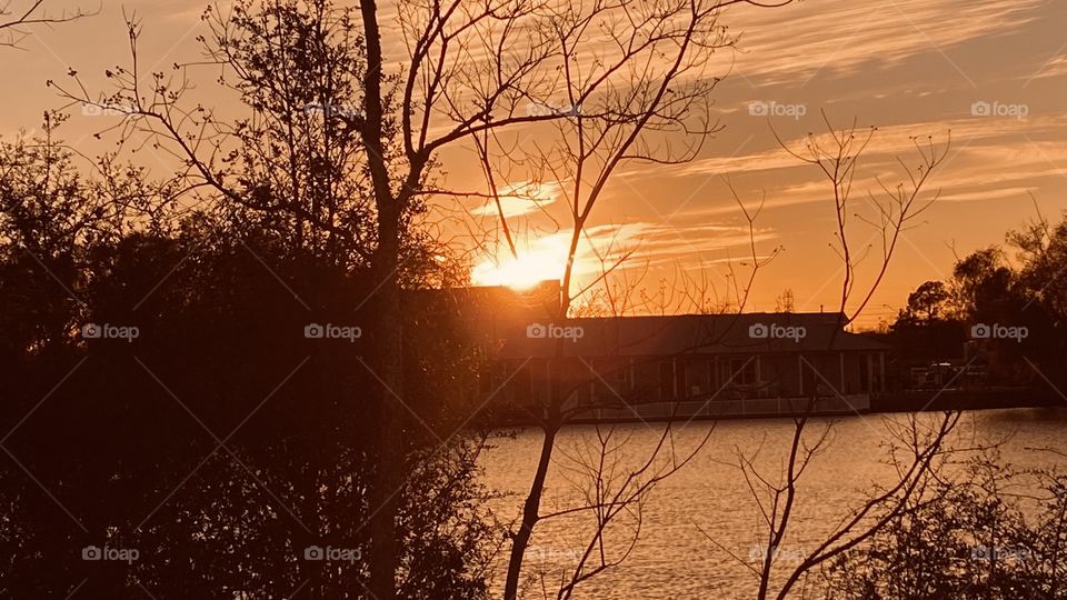 Sun setting creating high clouds glowing with anticipation of a nice sunset this evening. 