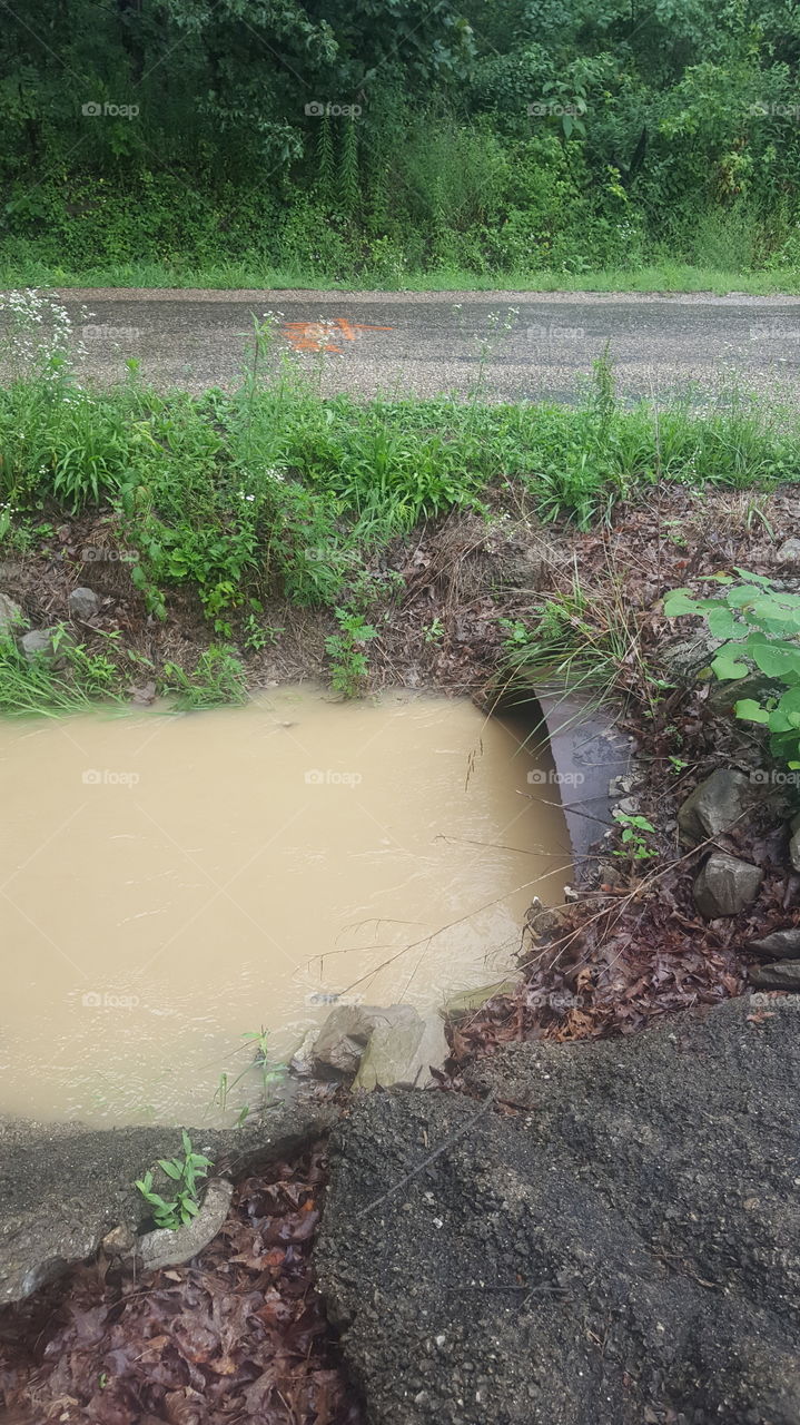 ditch full of rain water after a storm