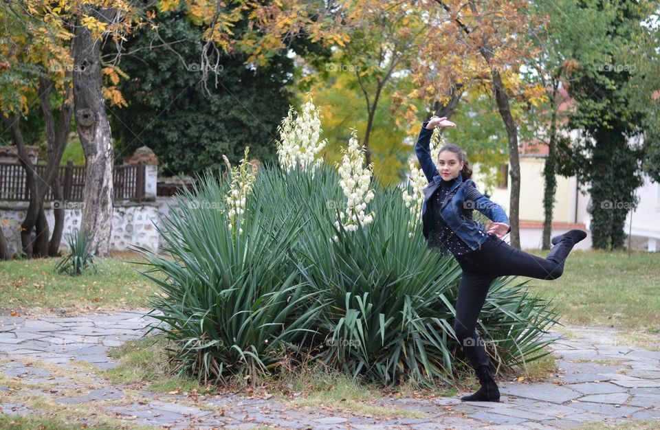 Beautiful Young Girl Dancing Outside in Nature